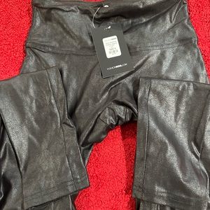 Black body sculpting coated leggings.